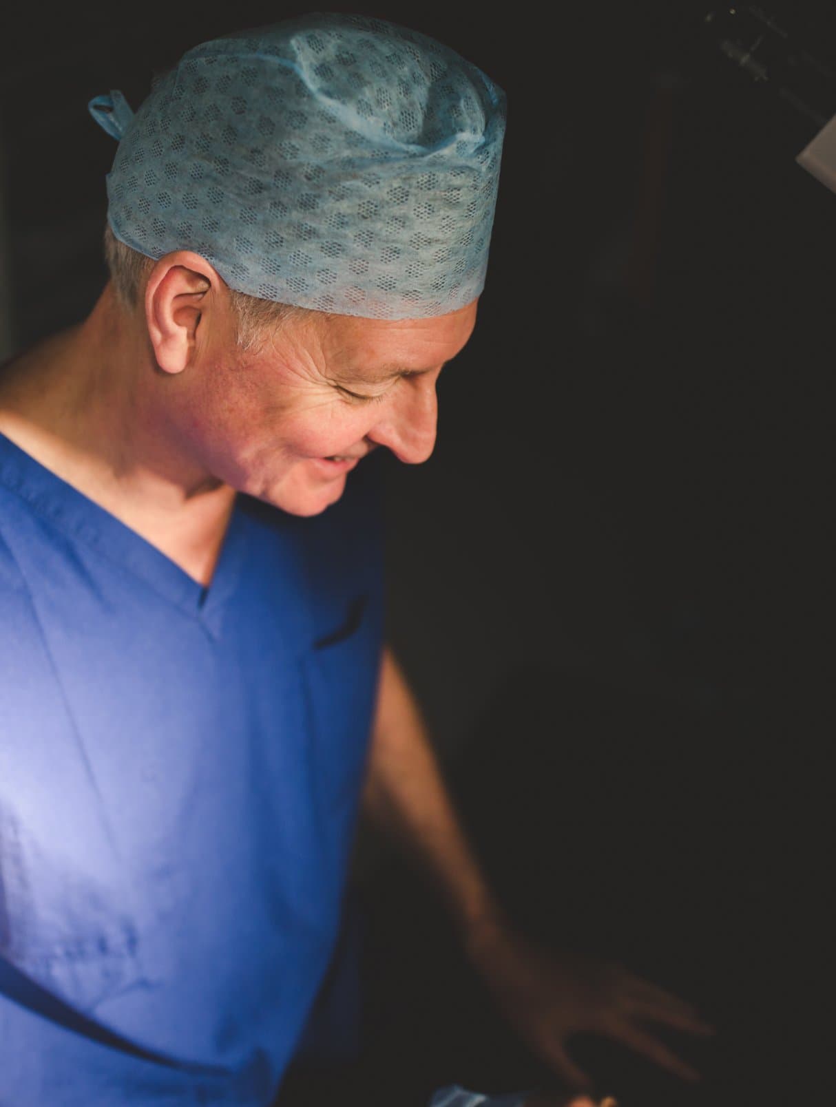 Ophthalmology surgeon Andrew Luff (Andy Luff) talking to a cataract patient